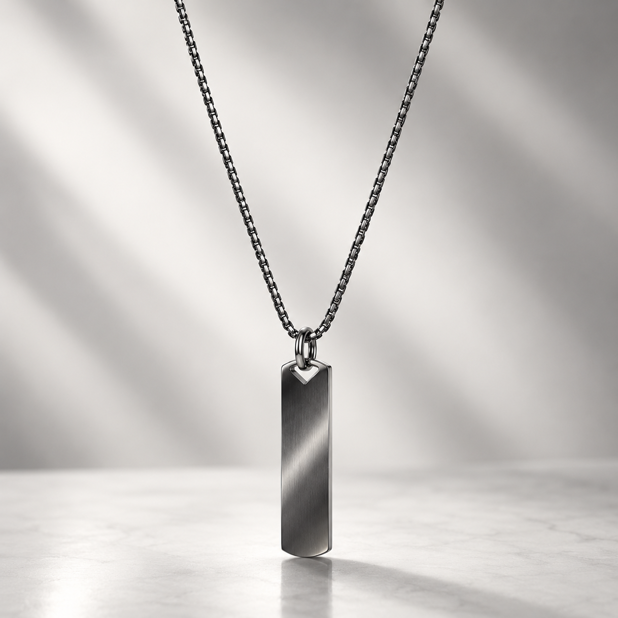 A polished rectangular pendant men necklace on a fine chain in doha qatar