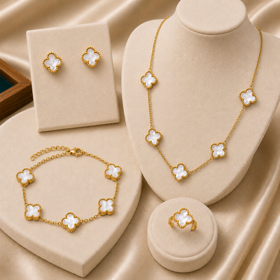 Shop an elegant premium stainless steel gold clover jewelry set for women in Qatar. Includes necklace, bracelet, ring and matching earrings. Perfect for gifting.