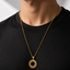 a gold chain for men necklace with a textured circular ayat al kursi pendant 