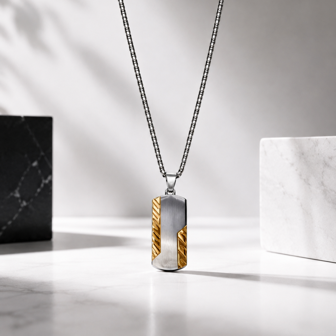 A silver-toned ball chain for men necklace with a rectangular pendant featuring a silver center and two textured gold side panels