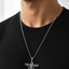 a man's neck and chest wearing a silver chain men necklace with a detailed winged  eagle pendant