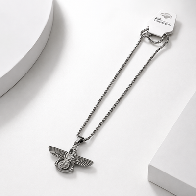 A silver-toned stainless steel  eagle pendant for men necklace featuring a winged insect or beetle design.