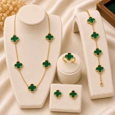 Shop an elegant green clover jewelry set featuring a matching necklace, bracelet, earrings and ring with beautiful gold-tone detailing. Perfect for women and gifting.